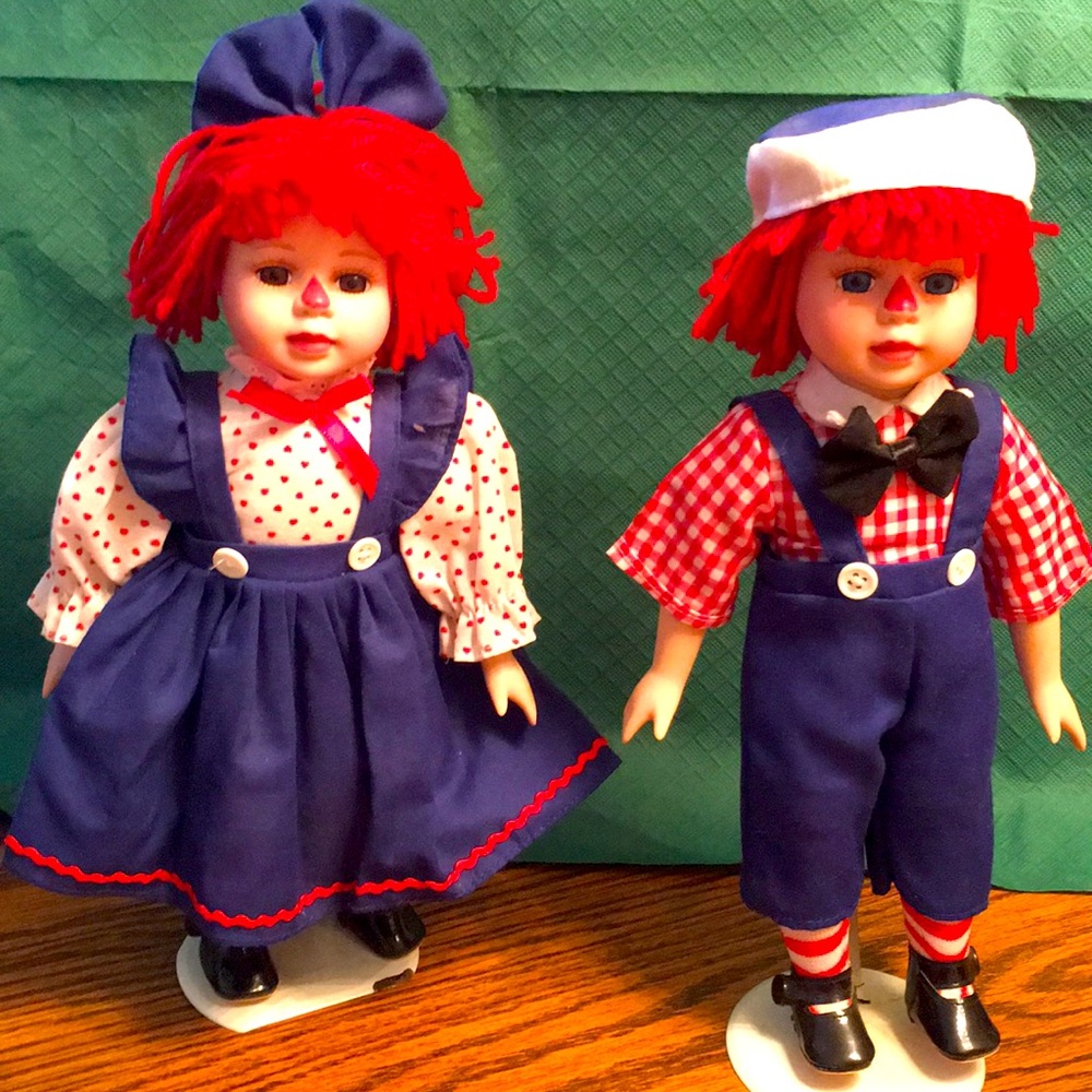 Raggedy Ann and Andy porcelain vintage dolls on metal stand
